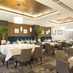 The image showcases a newly renovated, spacious hotel lobby or lounge area with a modern yet elegant design.